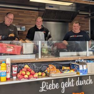 Employees serving food at a food truck