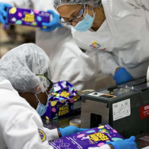 Workers packaging snacks 