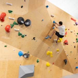 Person climbing a rock wall