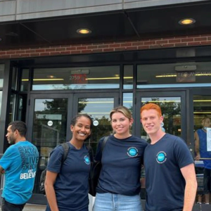 Three volunteers at Part of the Solution