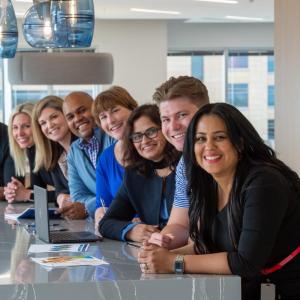Pentair employees gather at table