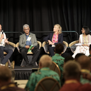 Four people sat on stage having a discussion