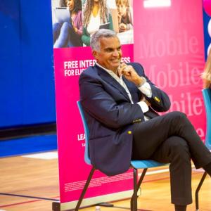 Two people sat on chairs 