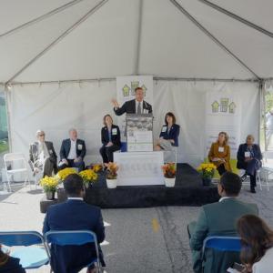 Speaker at a podium in front of audience