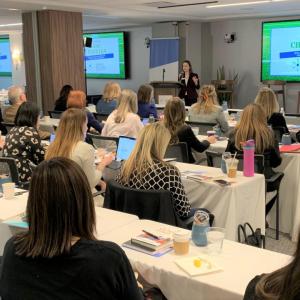 Room of Points of Light Corporate Service Council Summit attendees listening to a presentation.