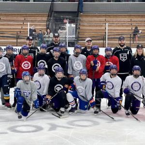LA Kings players pose with youth hockey players from LA Lions.