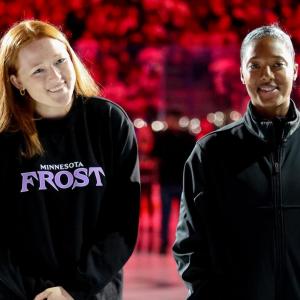 Minnesota Frost forward Dominique Petrie and LA Kings NHL Scout Blake Bolden in pregrame ceremony