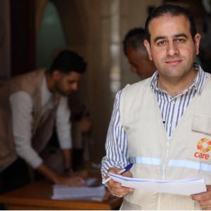 A man in an aid worker vest. 