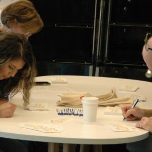 volunteers writing notes