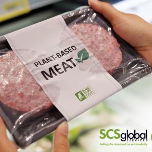 Person holding plant-based meat package