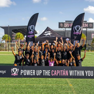 Group of young girls with sign that says "Power up the Capitan within you
