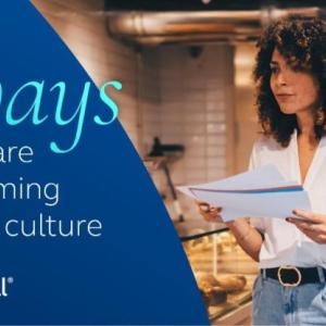 3 Ways women are transforming business culture. Woman reading a report in a restaurant.