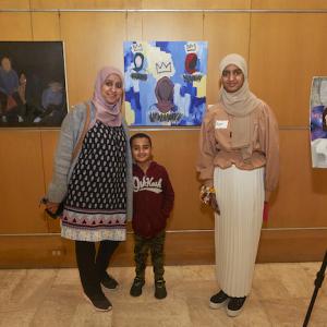Family shown in art gallery.