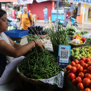 Woman working at a vegetable stand
