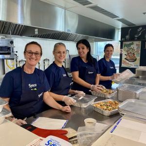 Sysco volunteers preparing food