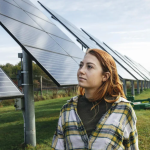 Woman standing in front of solar panels