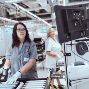 Two female workers inspecting products for quality.