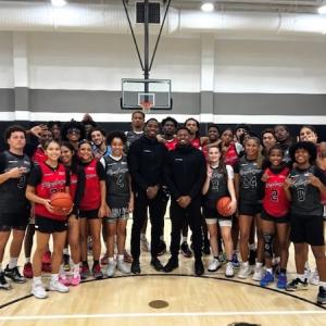 Rise League basketball team shown with the two coaches.