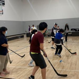 Students play ball hockey