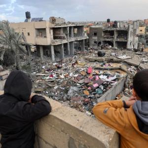 Palestinian children look at the rubble of a building destroyed during Israeli attacks in Rafah, southern Gaza Strip, last November © Mohammed Abed / AFP
