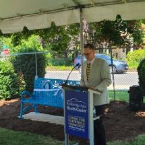 Person speaking at lectern during presentation event