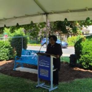 Person speaking at lectern during presentation event
