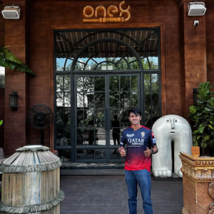 Rahul outside of a restaurant.