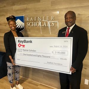 Representatives from Rainier Scholars receive a grant check from KeyBank for $180,000.