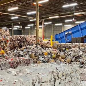 Truck dropping off a load at recycling facility