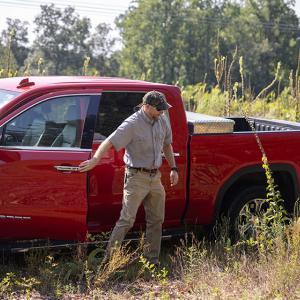 Will Ricks getting out of a red car