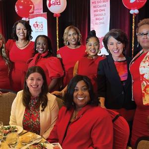 A group of women posed at a table.