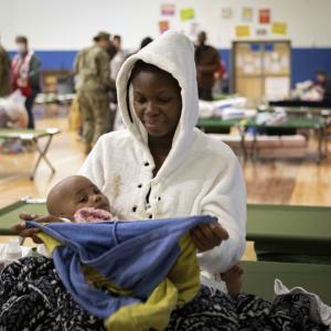 A mother and baby at a Red Cross shelter