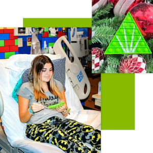 Child in hospital bed receives holiday ornament