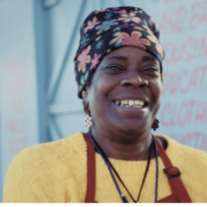 Smiling woman wearing an apron