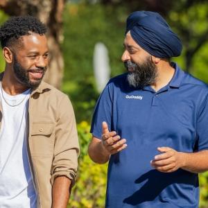 GoDaddy CEO Aman Bhutani with a GoDaddy team member.