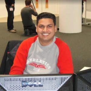 Sandeep shown at his computer. 