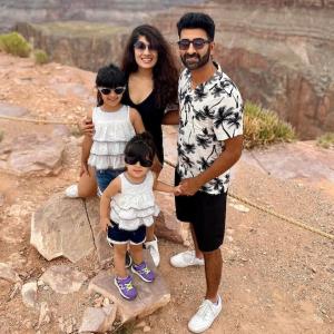 Richa Gandhi shown with her husband and two children at the Grand Canyon.