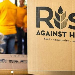 "Rise Against Hunger" written on boxes