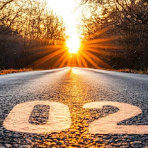 Road with setting sun and 2026