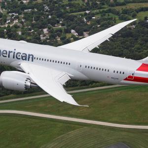An airplane in flight. American logo on the side.
