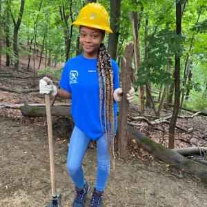 SCA Team member preparing the ground for planting. 