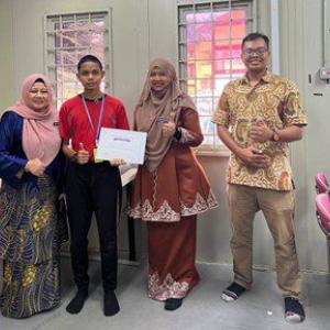 4 people stood together for a photo