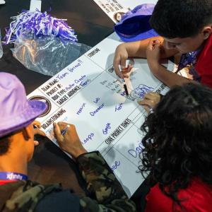 Three students working together on a project