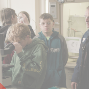 Students in a lab with their instructor