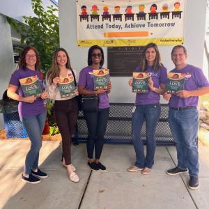 Saint Petersburg volunteers holding books