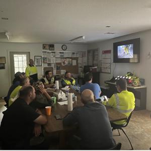 group of employees watch safety video