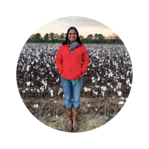 Shilpa Swarup stood in a crop field 