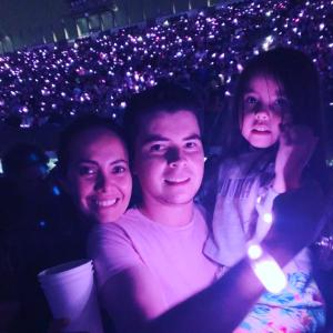 Woman, man, and daughter in a crowd