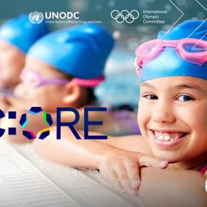 Children wearing a swimming cap and googles in a swimming pool