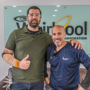 Scott Cabral and co worker in front of a whirlpool sign